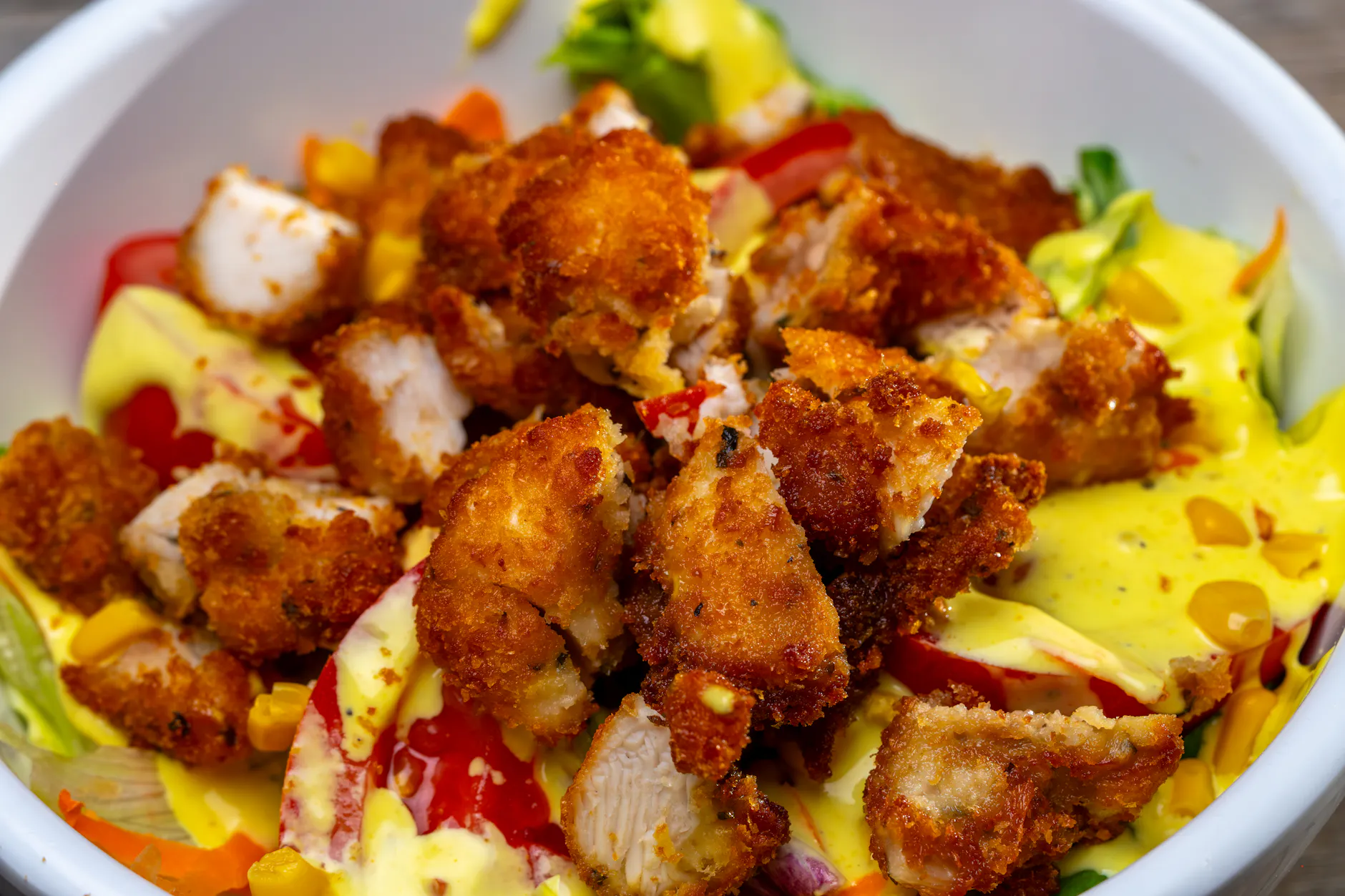 Top view of easy healthy dinner recipes like grilled chicken salad and roasted vegetable bowls